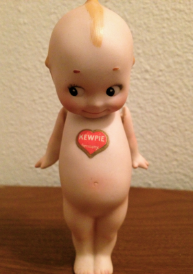 German bisque Kewpie, c. 1912, with original heart sticker on its chest