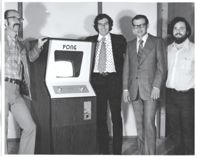 Ted Dabney, Nolan Bushnell, and Allan Alcorn with their Pong cabinet game