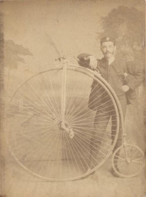 Man with his Penny Farthing bicycle 1