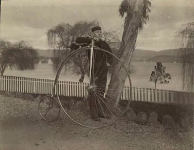 Man with his Penny Farthing bicycle 3