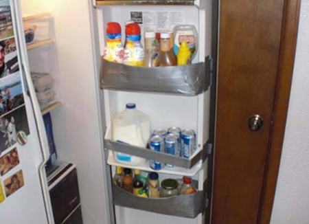 Duct tape holding refrigerator drawers together