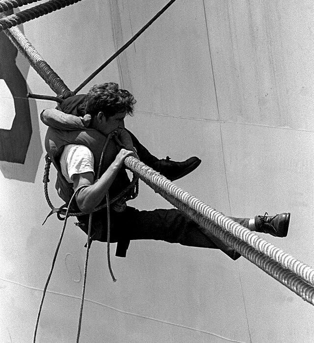 Hanging on for dear life 1 Man hanging from a mooring rope