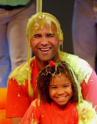Man and girl covered in slime on the Nickelodeon game show