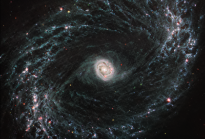 NGC 1433 spiral arms are littered with evidence of extremely young stars releasing energy