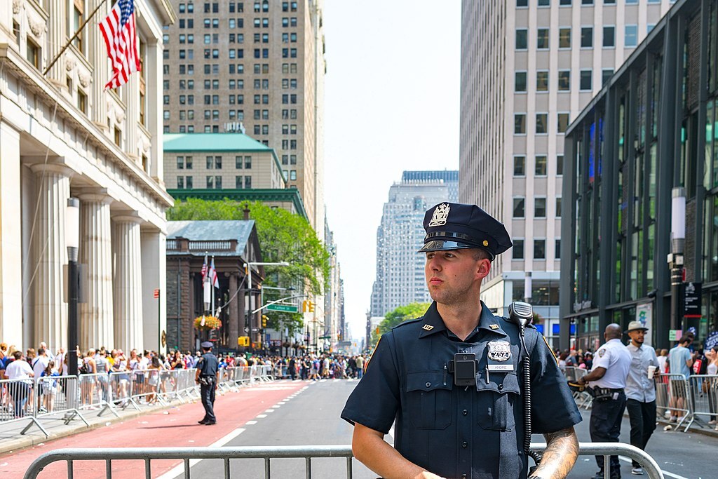 A NYPD police officer managing crowds in New York City