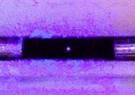 Photo of a single atom (dot in center)