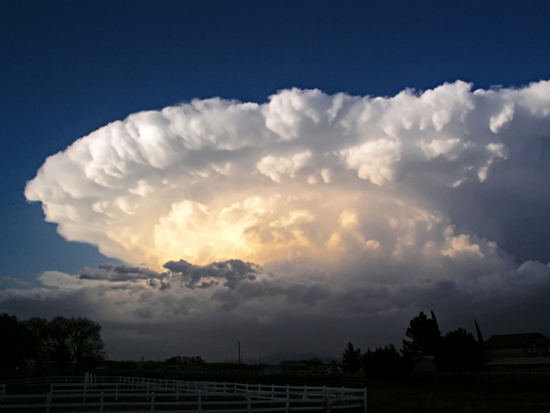 Supercell thunderstorm feature huge rotating white clouds