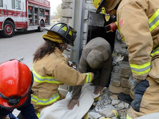 Man trapped inside Marshall's store wall for 3 days crawls out after firefighters tear down part of exterior wall