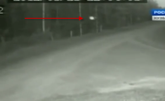 White orb UFO caught travelling down darkened road in Russia