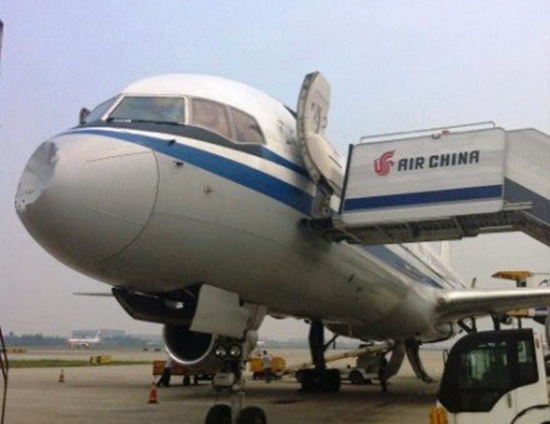 Chinese plane grounded after collision with "ufo" - extensive damage to nosecone from the strike. 1 Damage to nose cone of Chinese Boeing 757 after collision