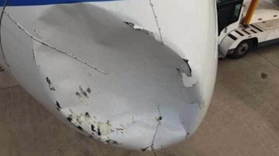 Close-up of damage to nose cone of chinese boeing 757 after collision with ufo Close-up of damage to nose cone of Chinese Boeing 757 after collision with UFO
