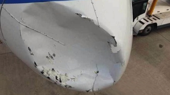 Close-up of damage to nose cone of Chinese Boeing 757 after collision with UFO