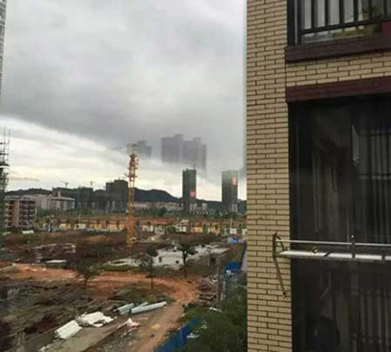 Photo of a mysterious ghost city floating in the sky above Foshan China