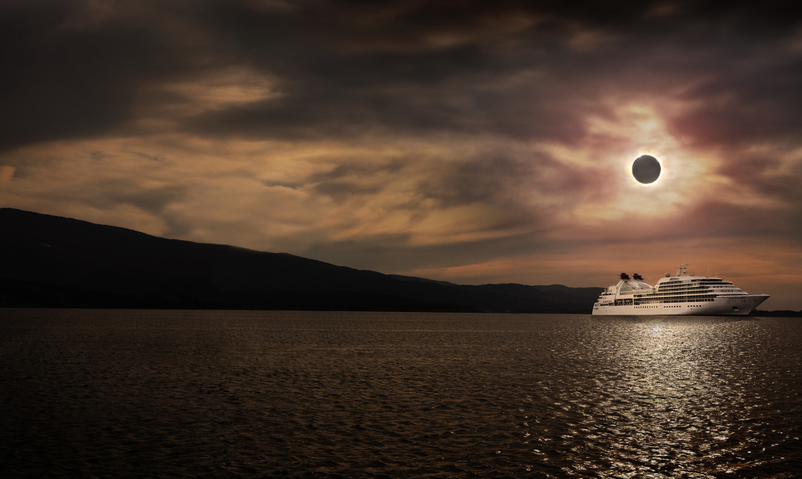 Seabourn cruise ship on ocean during a solar eclipse