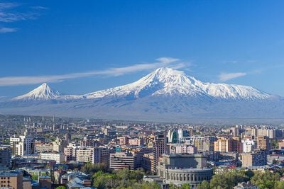 Mount Ararat and the Yerevan skyline in spring. The Opera house is visible in the bottom right.