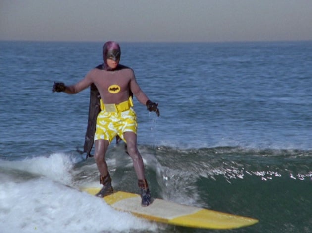 Batman ’66’s surfing episode gave us its most ridiculous gadget 1 Batman surfing on a surfboard wearing swim swimming trunks