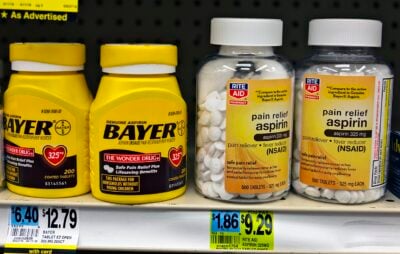 Bottles of Aspirin, made by Bayer and Rite Aid, side-by-side on a store shelf in Montgomery, NY, USA. Both manufacturers may use the brand name generically since aspirin is not a protected trademark in the U.S.