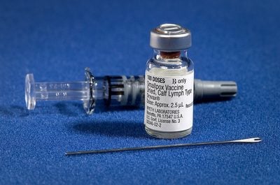 Vaccine bottle and needle