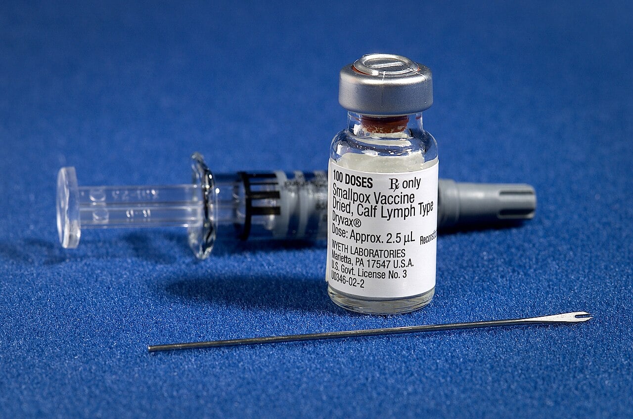 Vaccine bottle and needle